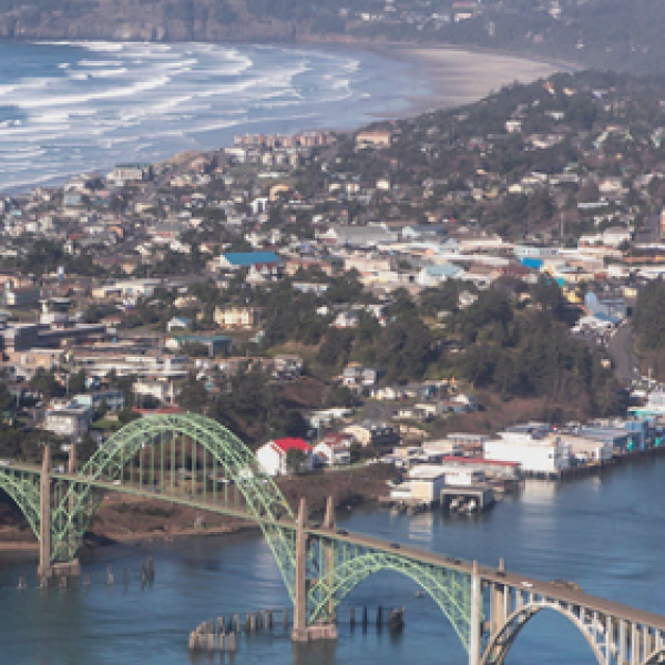 A view of the beach, the bridge, and the bay in Newport.